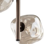 Lampa wisząca Lava Brown 3xG9 w brązowym kolorze, z metalowym wieszakiem w odcieniu brązowym. Szklane klosze mają organiczny kształt, przezroczyste z delikatnym brązowym zabarwieniem. Widok z góry, akcentujący szczegóły montażu i kształt kloszy.