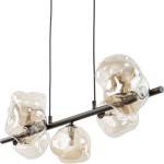 Lava Brown lampa wisząca z brązowym metalowym stelażem i siedmioma szklanymi kloszami w kształcie bąbli. Klosze w odcieniu brązowym, zawieszona na dwóch czarnych linkach, z widocznymi źródłami światła G9.