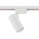 Reflektor spot Tracer 1xGU10 w białym kolorze, zamontowany na szynie 1-fazowej. Cylindryczny kształt lampy z widoczną soczewką, ustawiony pod kątem, umożliwiający regulację kierunku światła. Prosta konstrukcja, idealna do oświetlenia wnętrz.