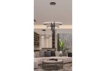 Lampa wisząca LED Amanda 40W+9W w kolorze czarnym, z okrągłym pierścieniem i trzema wiszącymi detalami, umieszczona w nowoczesnym wnętrzu. Widoczna w aranżacji salonu z roślinami i meblami w neutralnych odcieniach.