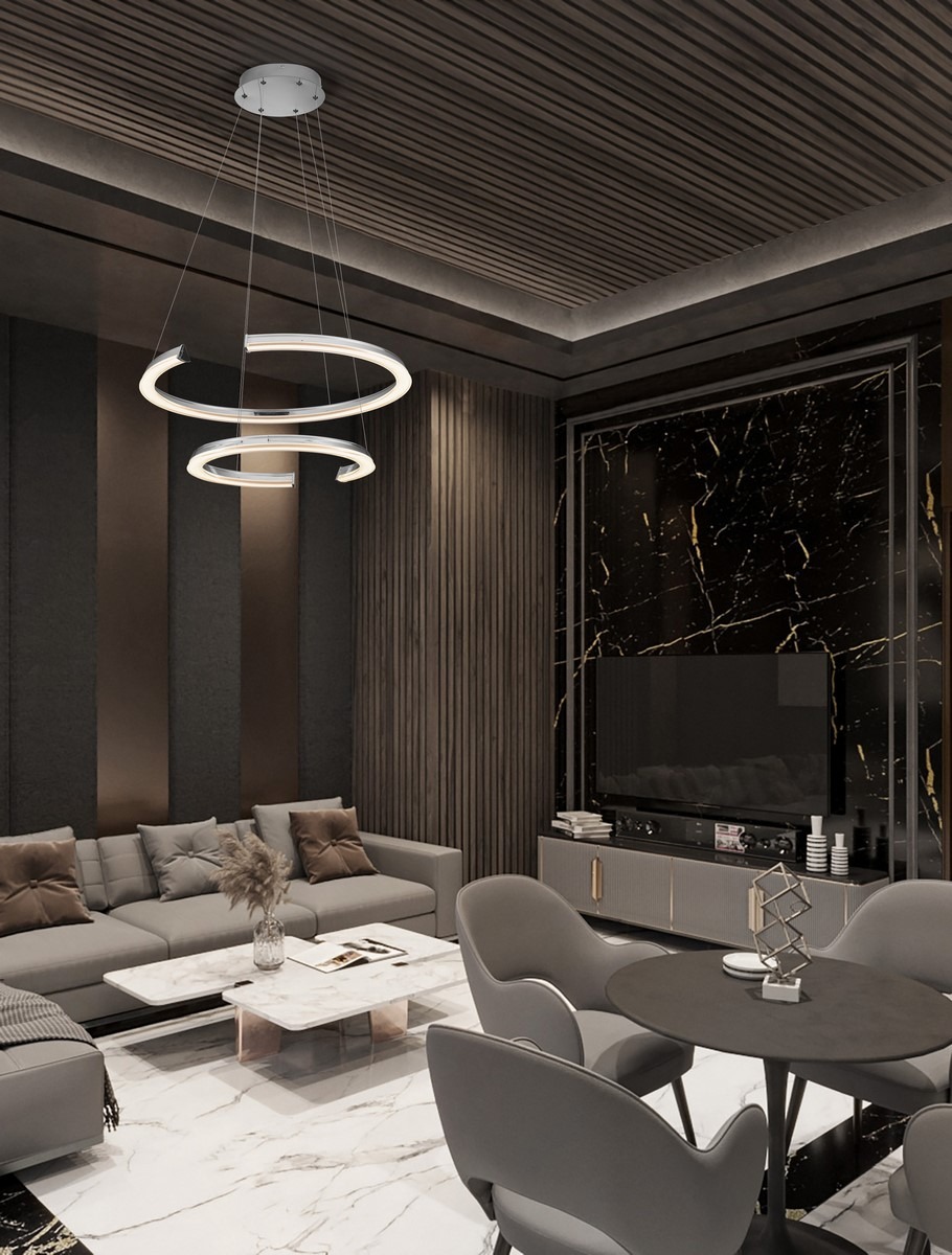 Lampa wisząca Orinoco 2xLED 70W w kolorze srebrnym, z dwoma okrągłymi elementami świetlnymi zawieszonymi na cienkich linkach, umieszczona w nowoczesnym wnętrzu z ciemnymi ścianami i eleganckimi meblami.