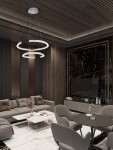 Lampa wisząca Orinoco 2xLED 70W w kolorze srebrnym, z dwoma okrągłymi elementami świetlnymi zawieszonymi na cienkich linkach, umieszczona w nowoczesnym wnętrzu z ciemnymi ścianami i eleganckimi meblami.