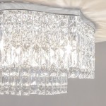 Lampa sufitowa Dune 6-punktowa, chromowana, z kryształowymi elementami. Widoczny detal klosza z wieloma przezroczystymi, szklanymi kryształami w formie prostokątów, tworzącymi efektowną teksturę. Ujęcie z dołu, podkreślające blask i elegancję lampy.