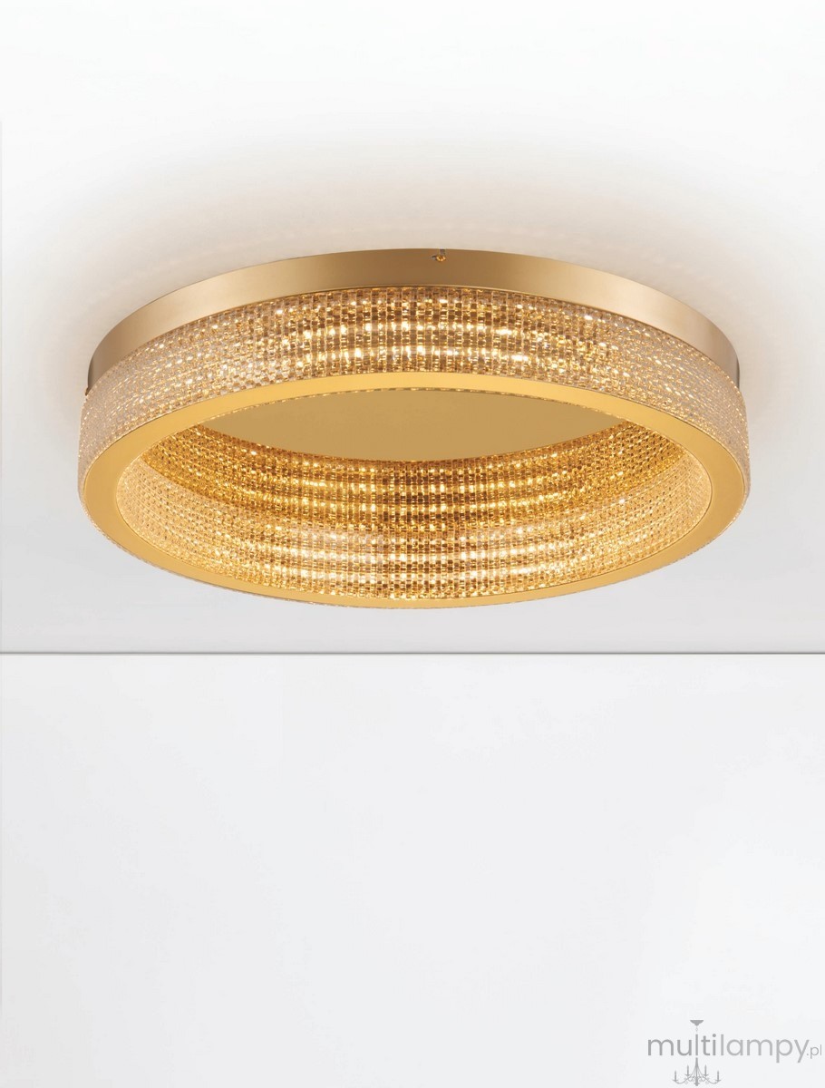 Lampa sufitowa Yotau 1xLED 70W w złotym kolorze, okrągła, z dekoracyjnymi kryształkami. Widok z dołu, montowana do sufitu, z wyraźnym blaskiem. Świeci intensywnym światłem, elegancki design, idealna do nowoczesnych wnętrz.