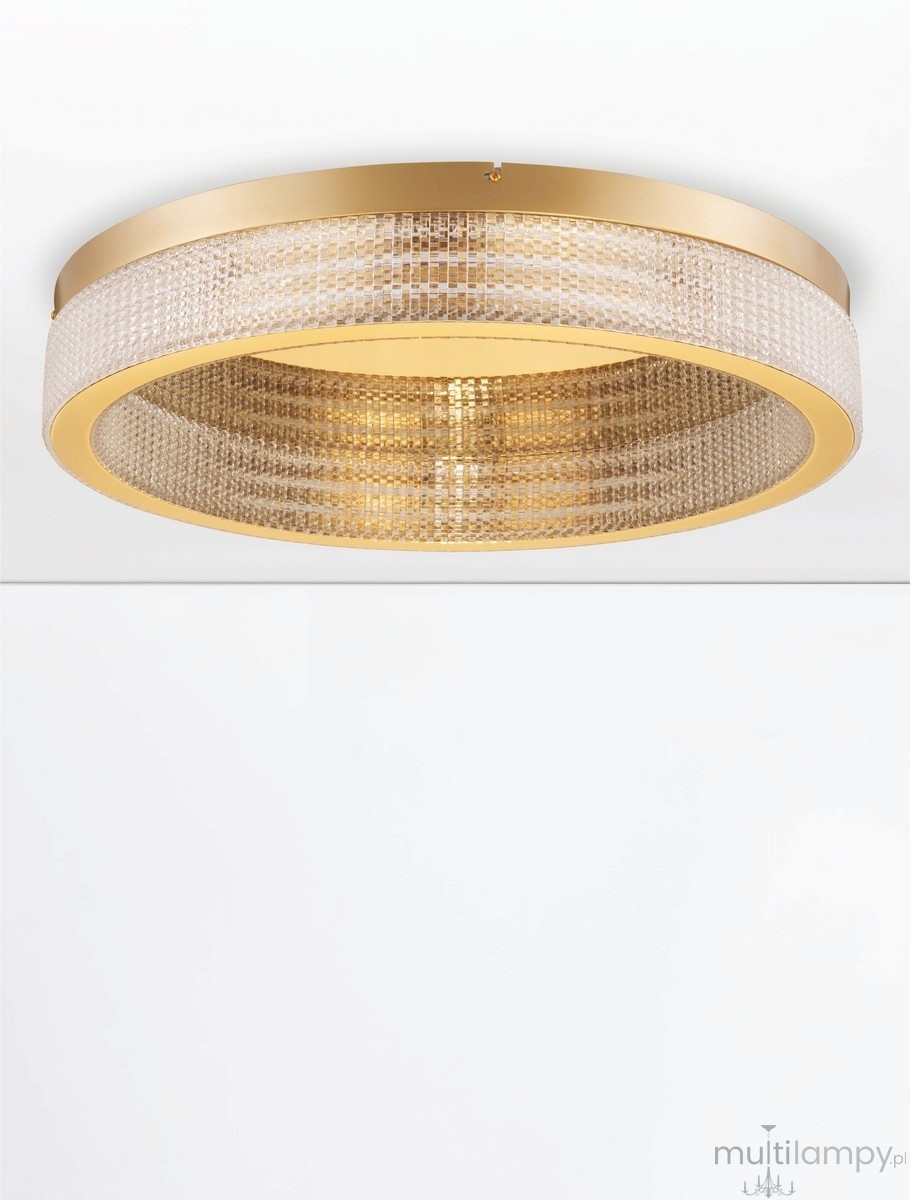 Lampa sufitowa Yotau 1xLED 70W w kolorze złotym, o okrągłym kształcie z przezroczystym kloszem, z siatką z kryształków. Ujęcie frontalne, zamontowana na białym tle, doskonale oświetli każde wnętrze.