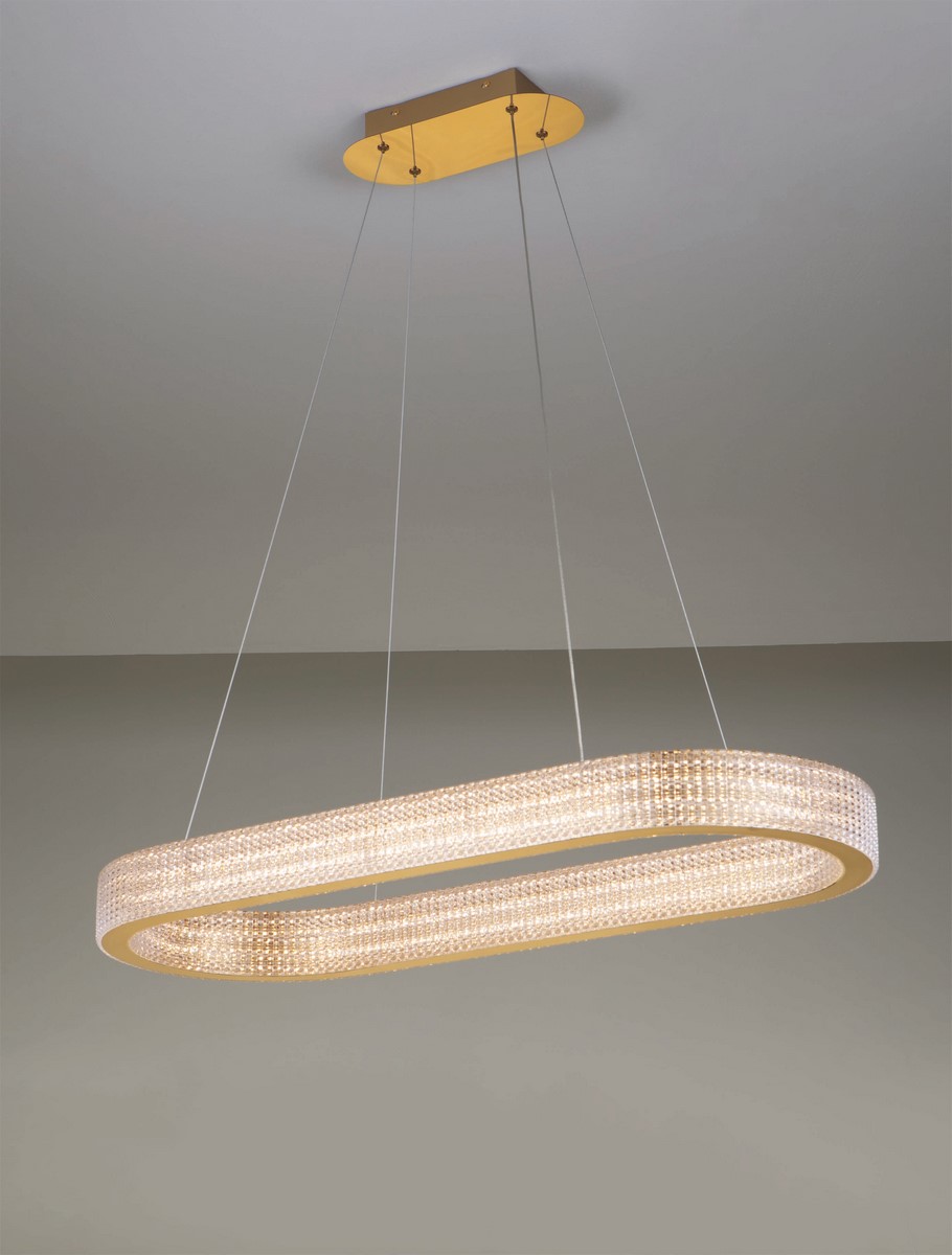 Lampa wisząca Yotau z jedną diodą LED 70W w złotym kolorze, o owalnym kształcie, zawieszona na cienkich żyłkach. Widoczna elegancka obudowa z kryształkami, montowana pod sufitem na prostokątnej podstawie.