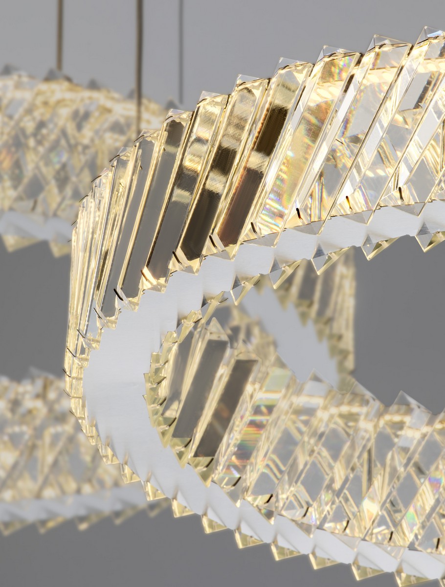 Lampa wisząca Canlira 3xLED 129W w kolorze niklu, z trzema pierścieniami z przezroczystych, teksturowanych kryształów, tworzącymi efekt świetlny. Produkt prezentowany z góry, zawieszony w minimalistycznym otoczeniu na szarym tle.