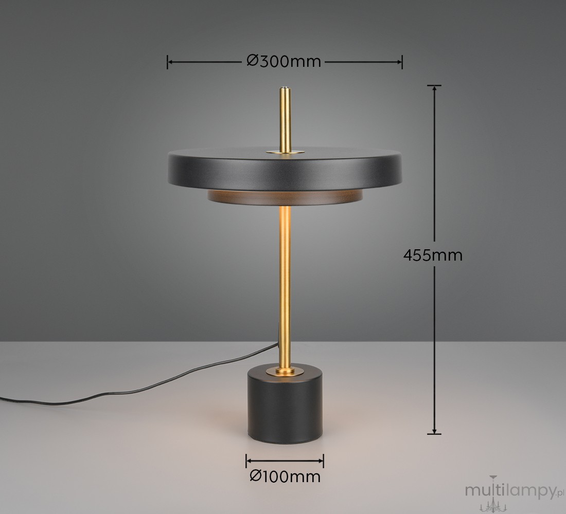 Lampa stołowa Keaton w kolorze czarnym i złotym, z wbudowanym źródłem LED 12W. Okrągła podstawa o średnicy 100 mm, wysokość 455 mm, klosz o średnicy 300 mm. Prosty design, minimalistyczny styl, idealna do nowoczesnych wnętrz.