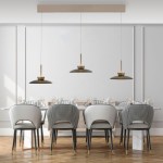 Lampa wisząca Pure Moon 6xLED 47 W, w kolorze czarnym z metalowymi detalami, zawieszona nad eleganckim stołem z krzesłami o białym i szarym obiciu. Prosty, nowoczesny design w jasnym wnętrzu.