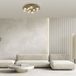 Lampa sufitowa Pure Popup o złotym wykończeniu, z pilotem, z 11 diodami LED o mocy 33W. Ujęcie z dołu, montowana na suficie, w nowoczesnym wnętrzu z jasnymi meblami i akcentami dekoracyjnymi.