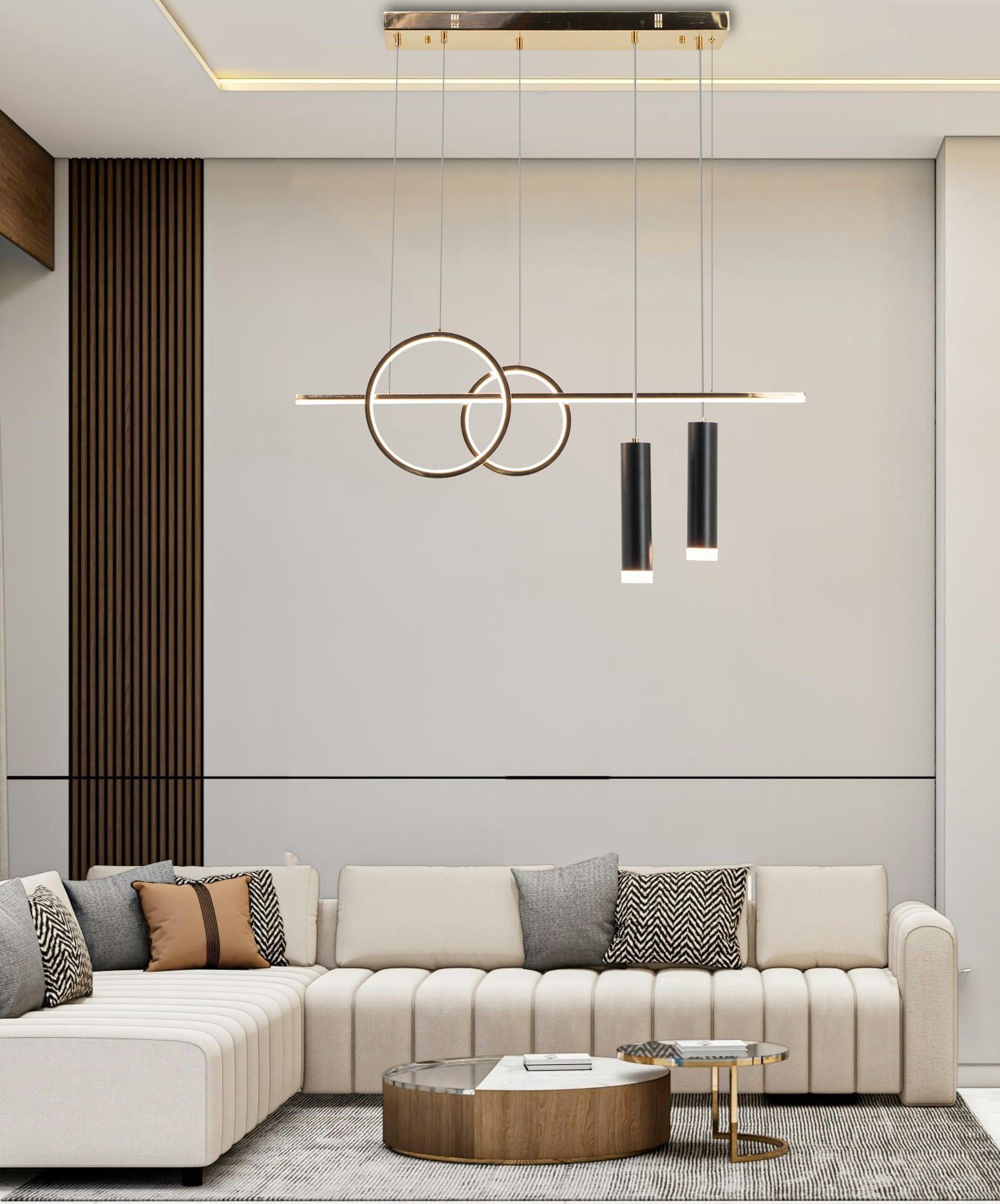 Lampa wisząca Moderno z dwoma okręgami i trzema cylindrycznymi źródłami światła LED, w kolorze złotym. Zawieszona na cienkich linkach, idealna do nowoczesnych wnętrz. Ujęcie z dołu, w tle kanapa i stolik kawowy.