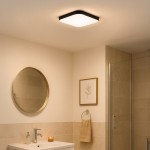 Plafon Nemo LED D33 w kolorze czarnym, o kwadratowym kształcie, z białym kloszem, zamontowany na suficie. Oświetlenie o mocy 17W i temperaturze barwowej 4000K, idealne do łazienki, w otoczeniu jasnych płytek i dodatków.