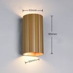 Kinkiet Soka w kolorze kawowym, o cylindrycznym kształcie z żłobieniami. Wymiary: 180 mm wysokości, 95 mm średnicy, 85 mm szerokości. Wbudowane dwa gniazda GU10, emitujące światło w górę i w dół. Montowany na ścianie, w tle jednolita powierzchnia.