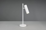 Lampa stołowa Soka w kolorze białym z podstawą okrągłą. Uchwyt z cylindryczną głowicą o żebrowanej teksturze, skierowaną na bok. Posiada jedno gniazdo na żarówkę GU10. Produkt ustawiony na jednolitym tle, na stole.