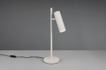 Lampa stołowa Soka w kolorze szarym z regulowanym kloszem w formie cylindrycznej, umieszczona na okrągłej podstawie. Ujęcie z boku, z widocznym kablem z włącznikiem. Kluczowa funkcja to możliwość skierowania światła.