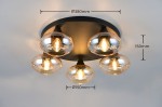 Lampa sufitowa Divina w kolorze czarnym z pięcioma żarówkami E14. Klosze bursztynowe w kształcie kul, zamontowane na okrągłej podstawie. Wymiary: Ø380 mm, wysokość 150 mm. Produkt widoczny z góry, z detalami kloszy i mocowania.