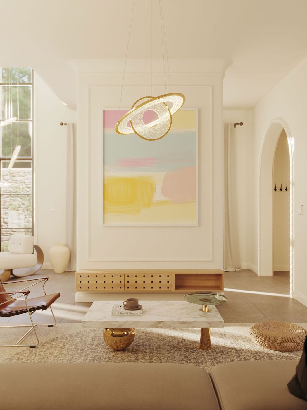 Lampa wisząca Alexia 2xLED 45W w złotym kolorze, o półokrągłym kształcie z centralnym otworem, zawieszona w nowoczesnym wnętrzu nad stolikiem kawowym. Tło z jasnymi ścianami i kolorowym obrazem.