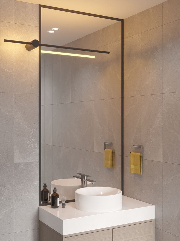 Czarny kinkiet Spirit 1xLED 12W, zamontowany nad lustrem w nowoczesnej łazience. Prosty, minimalistyczny kształt z poziomą lampą LED, otoczenie w odcieniach szarości, widoczne akcesoria łazienkowe oraz umywalka.
