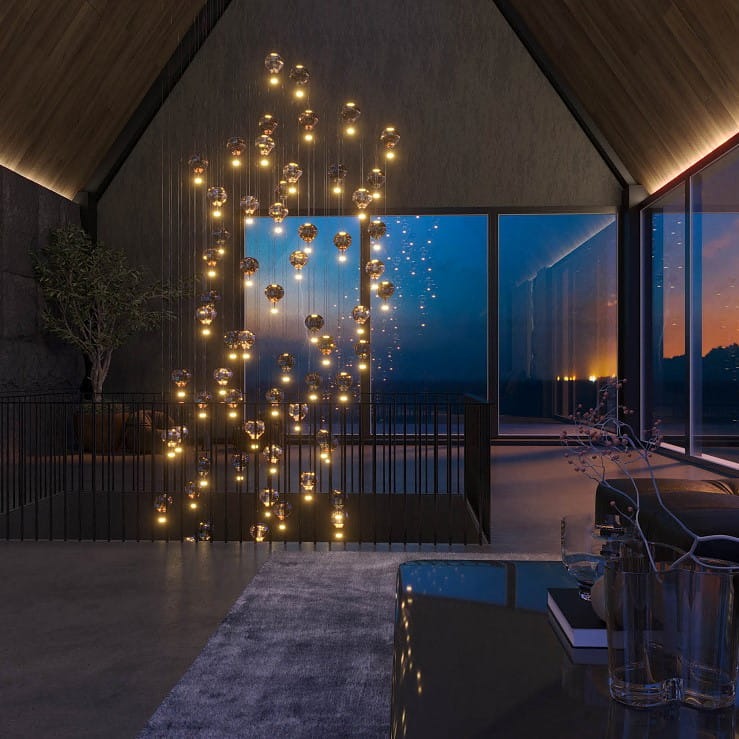 Lampa wisząca Palloncini z 11 żarówkami LED o mocy 66W, w kolorze białym z multikolorowymi akcentami. Zawieszona w nowoczesnym wnętrzu, z efektownym układem świetlnym, w otoczeniu dużych okien i minimalistycznych mebli.