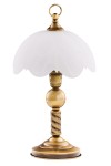 Lampa stołowa Jupiter z mosiądzu patynowanego, z białym kloszem o falistym kształcie. Ujęcie frontalne, stojąca na okrągłej podstawie. Widoczne ozdobne elementy, w tym spiralny detal na nodze lampy.