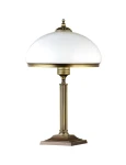 Lampa stołowa Zeus z mosiądzu patynowanego, z białym kloszem w kształcie kopuły. Produkt ma prostą, cylindryczną nogę z delikatnym żłobieniem, ustawioną na kwadratowej podstawie. Dwa gniazda E14, widok frontalny.