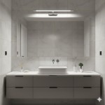 Kinkiet Klimt L60 LED 12W CCT IP44 w chromowanej obudowie, zamontowany nad umywalką. Oświetlenie skierowane w dół, na jasnym tle marmurowych płytek. Produkt idealny do łazienek, odporny na wilgoć.