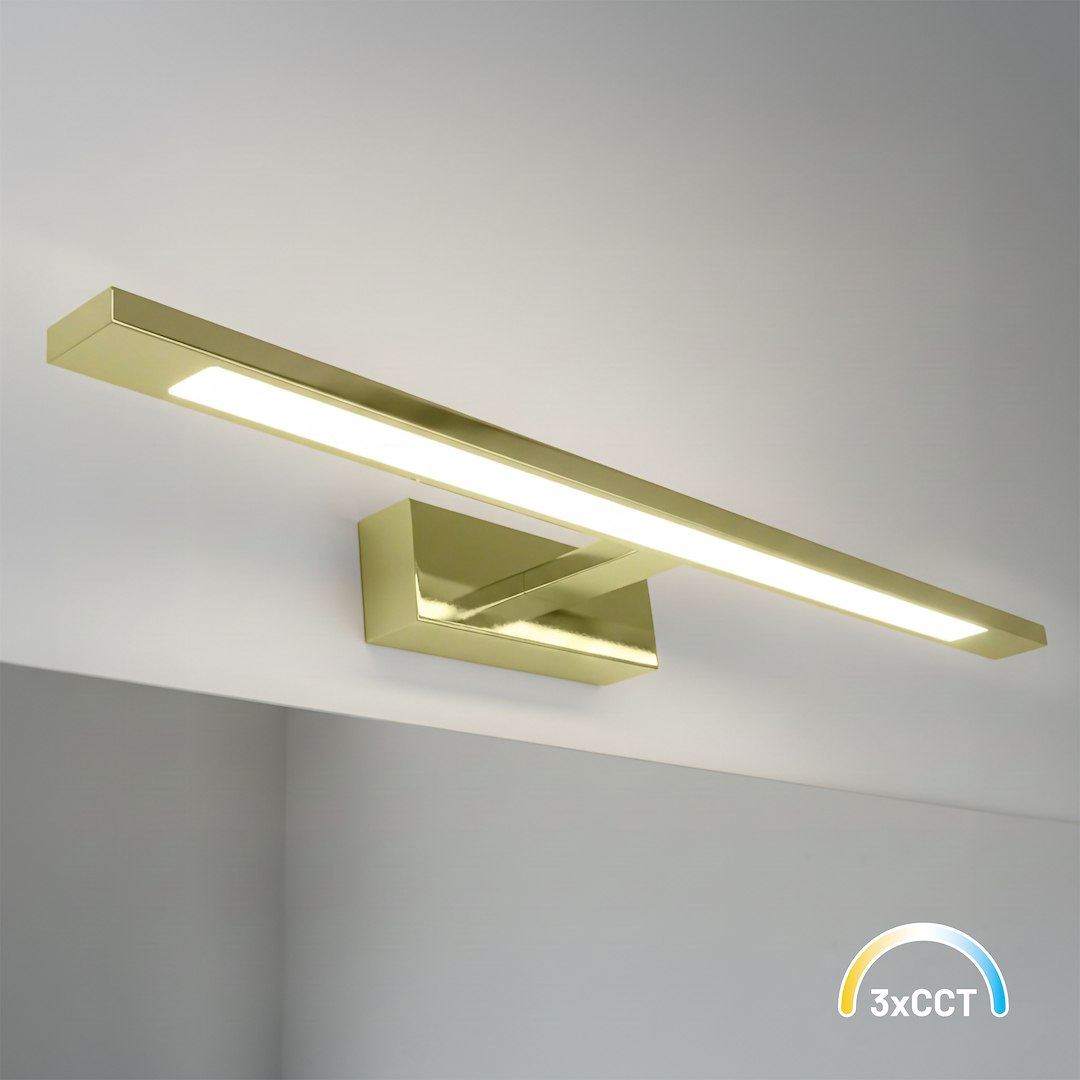 Kinkiet Klimt L60 LED 12W CCT IP44 w kolorze złotym, z prostokątnym, połyskującym korpusem i wbudowanym źródłem światła. Produkt zamontowany na ścianie, z widoczną liniową diodą LED w centralnej części.