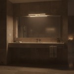 Kinkiet Klimt L60 LED 12W CCT IP44 w złotym kolorze, zamontowany nad lustrem w łazience. Wyposażony w subtelne oświetlenie, idealny do przestrzeni o podwyższonej wilgotności. Ujęcie frontalne, w tle widoczne elementy łazienkowe.