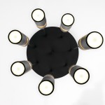 Lampa wisząca Alas w kolorze czarnym z siedmioma oprawami na żarówki GU10. Ułożona na okrągłej podstawie, z widocznymi detalami metalowymi i ceramicznymi. Kąt ujęcia z góry, ukazujący równomierne rozmieszczenie źródeł światła.