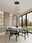 Lampa wisząca Glorica z trzema żarówkami LED (37W), czarna, z cylindrycznymi kloszami. Zawieszona na okrągłej podstawie, w nowoczesnej aranżacji kuchni lub jadalni, nad okrągłym stołem z białym blatem.