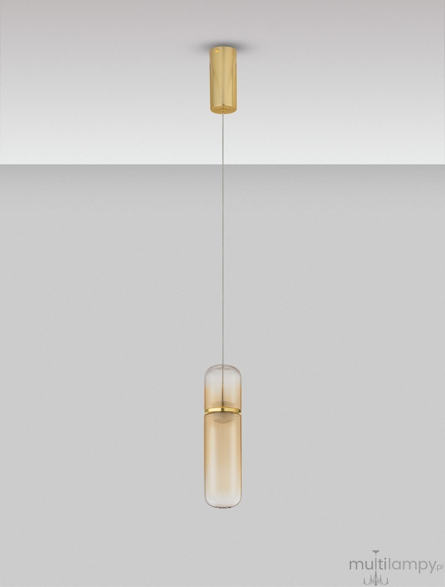 Lampa wisząca Rebalvo 1xLED 7W w złotym kolorze, z przezroczystym kloszem w kształcie cylindrycznym. Zawieszona na cienkim przewodzie, z okrągłym mocowaniem sufitowym. Tło w odcieniu szarym, podkreślające elegancki design.