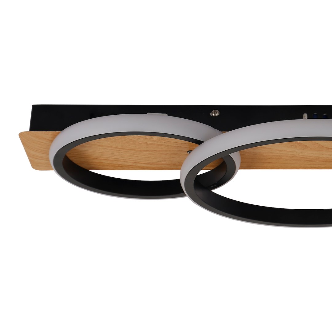 Lampa sufitowa LED Rowena 18W 4000K w kolorze czarnym, z dwiema okrągłymi oprawami z matowego szkła i czarnymi obrzeżami. Zamontowana na drewnianej podstawie, widok z góry.
