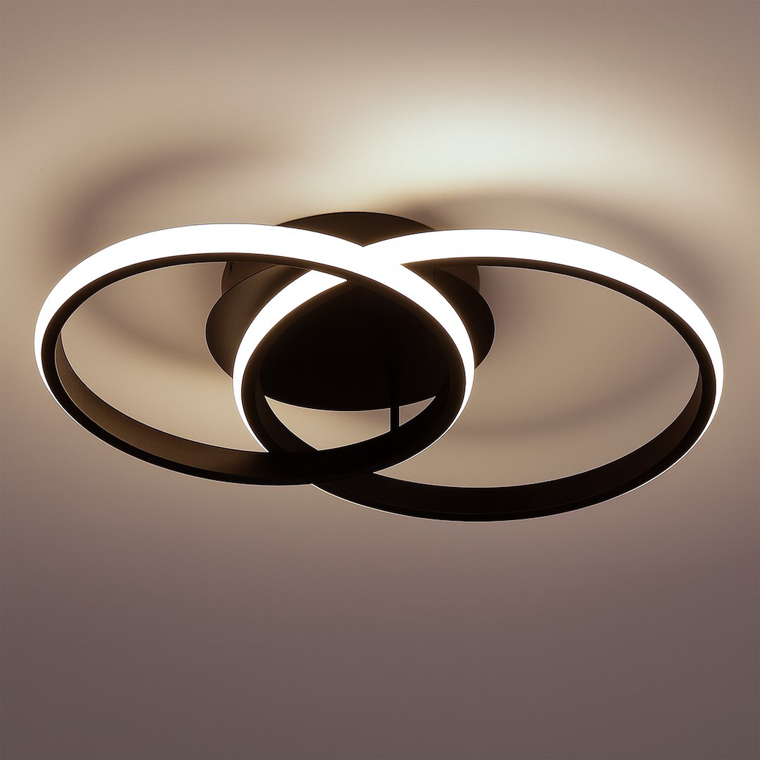 Lampa sufitowa LED 12W w kolorze czarnym, z dwoma okrągłymi pierścieniami. Oświetlenie w odcieniu 4000K, zamontowana na suficie. Detal zbliżenia na krawędzie pierścieni, które emitują światło.