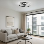 Lampa sufitowa LED 12W w kolorze czarnym, oświetlenie w kształcie dwóch nachodzących na siebie pierścieni. Zainstalowana na suficie w jasnym, nowoczesnym wnętrzu. Temperatura barwowa 4000K, zapewniająca neutralne światło.