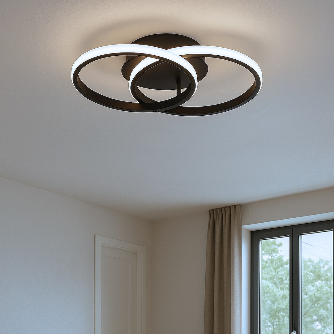 Lampa sufitowa LED Titano 12W 4000K w kolorze czarnym, z dwoma okrągłymi pierścieniami. Ujęcie z dołu, zamontowana na suficie, z białym światłem emitowanym przez wewnętrzne krawędzie. Prosta konstrukcja, idealna do nowoczesnych wnętrz.
