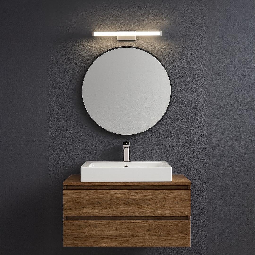 Kinkiet Mirore L30 LED 5W 4000K IP44 w kolorze srebrnym, zamontowany nad okrągłym lustrem. Oświetlenie umieszczone na ciemnoszarym tle, nad umywalką na drewnianej szafce. Prosty, nowoczesny design.