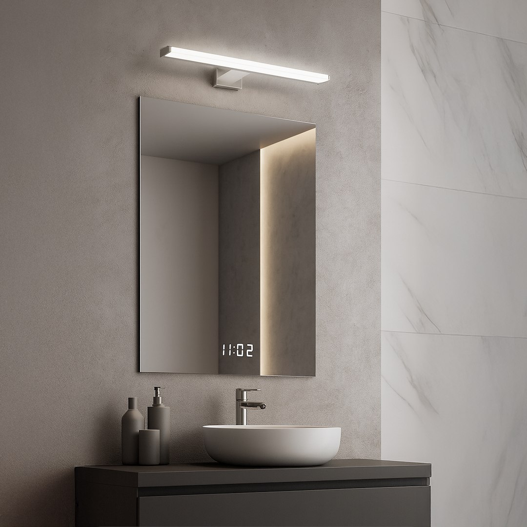 Mirore kinkiet L40 LED 8W 4000K IP44 w kolorze srebrnym, zamontowany nad lustrem w łazience. Kinkiet ma prostokątny kształt, emituje białe światło, a jego minimalistyczny design podkreśla nowoczesne wnętrze.