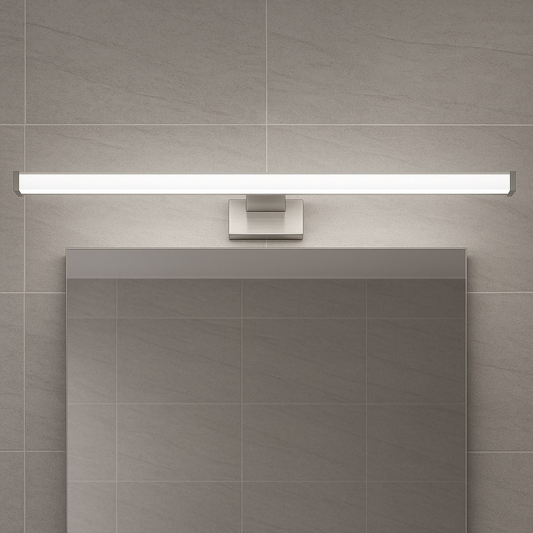 Mirore kinkiet L60 LED 10W 4000K IP44 w kolorze srebrnym, montowany na ścianie nad lustrem. Prosta, prostokątna forma z wbudowanym źródłem światła LED, umieszczony na tle gładkiej, jasnej płytki.