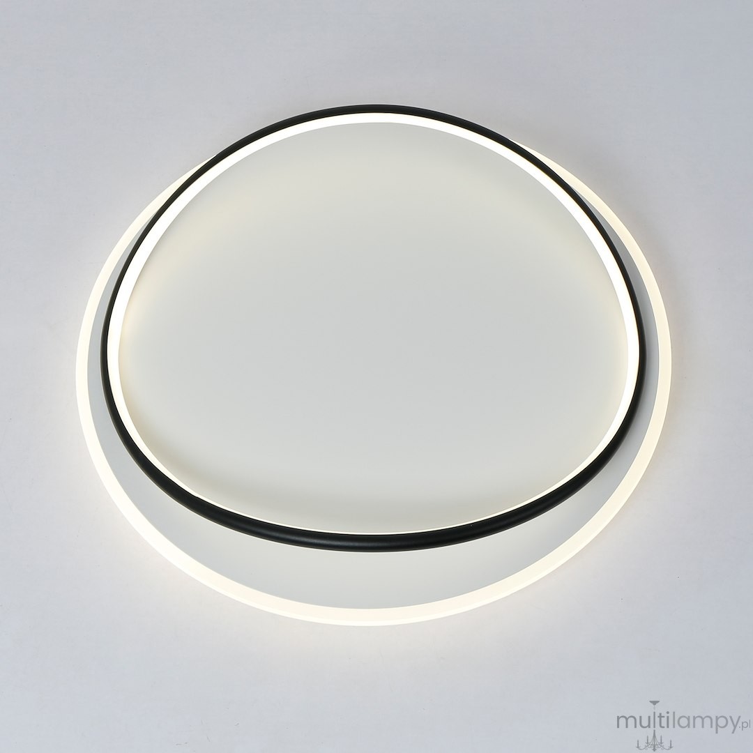 Lampa sufitowa LED Halo 38W 4000K w kolorze czarnym i białym, o okrągłym kształcie. Wykończenie z matowego tworzywa z czarną oprawą wzdłuż krawędzi. Zawieszona w pozycji poziomej, emitująca równomierne, neutralne światło.