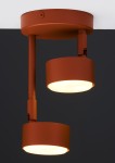 Lampa wisząca Nemo 2xGX53 w ceglastym kolorze. Posiada dwa okrągłe klosze zamocowane na regulowanych ramionach, montowana do sufitu. Klosze emitują światło w dół, a całość ma matową, teksturowaną powierzchnię.