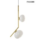 Lampa wisząca Rugia 2xG9 w kolorze złotym, z białymi, okrągłymi kloszami. Klosze umieszczone na asymetrycznym ramieniu w kształcie litery L. Kabel czarny, lampa zawieszona w pozycji pionowej. Idealna do nowoczesnych wnętrz.