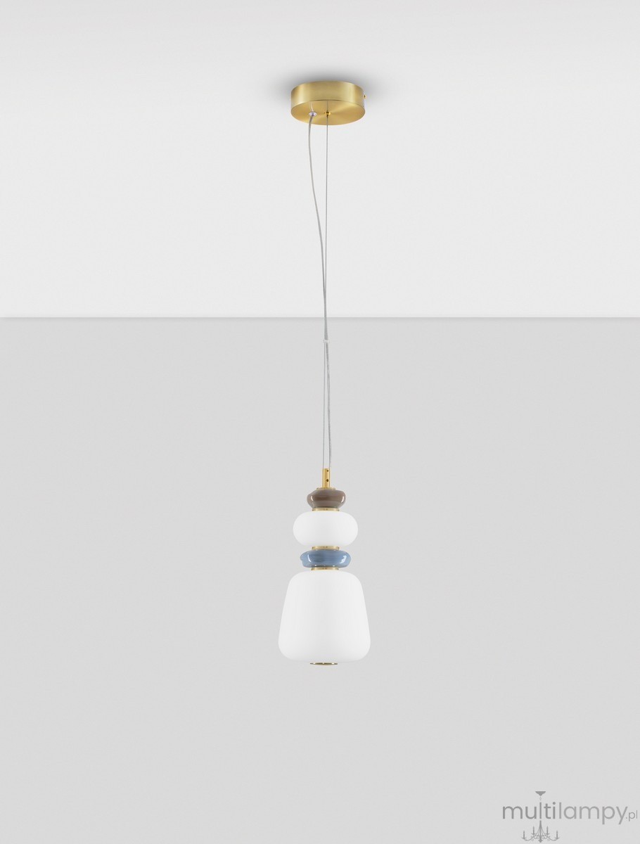 Lampa wisząca Felanzo z 1xLED 12W, złota z multikolorowym kloszem. Okrągła podsufitka, wiszący kabel, klosz w kształcie dzwonu z białego szkła oraz kolorowe elementy dekoracyjne w odcieniach brązu, niebieskiego i białego.