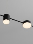 Lampa wisząca Orelvio 4xLED 20W CCT w kolorze czarnym, z okrągłymi kloszami i minimalistycznym designem, zawieszona na cienkim przewodzie, widoczna z góry, na jednolitym tle.