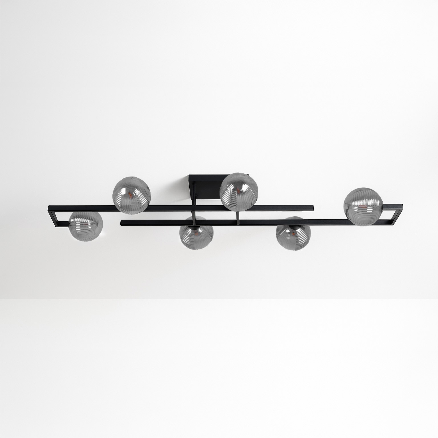 Lampa sufitowa Tores w kolorze czarnym i grafitowym z sześcioma kloszami G9. Prosta konstrukcja z metalowych ramion w układzie poziomym, z okrągłymi kloszami o teksturowanej powierzchni. Montaż sufitowy, idealna do nowoczesnych wnętrz.
