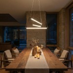Lampa wisząca Palos 3xLED 29W w kolorze czarnym, z trzema prostokątnymi kloszami, zawieszona nad drewnianym stołem. W tle widoczne kamienne ściany i okna, tworzące nowoczesną aranżację.