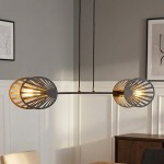 Lampa wisząca Playa 2-punktowa w kolorze czarnym, z metalowymi kloszami w kształcie półkul, z dekoracyjnymi wycięciami. Zawieszona na dwóch cienkich linkach, idealna do nowoczesnych wnętrz. Tło jasne, minimalistyczne.