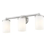 Kinkiet Jersey 3xE27 w wykończeniu nikiel satyna, z trzema cylindrycznymi kloszami z matowego szkła. Produkt zamontowany na ścianie, z widoczną stalową konstrukcją. Idealny do nowoczesnych wnętrz.