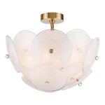 Lampa wisząca Arden w kolorze mosiądzu, z sześcioma oprawami E14. Okrągła, z przezroczystymi, falistymi kloszami, ułożonymi w kwiatowy wzór. Widoczny metalowy uchwyt montażowy. Delikatne, stonowane światło, idealna do nowoczesnych wnętrz.