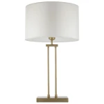 Lampa stołowa Athens z mosiądzu, wyposażona w okrągły biały klosz. Konstrukcja z dwoma prostymi nogami i prostokątną podstawą. Urok klasycznego designu, idealna do biura lub salonu. E27, 1x żarówka.