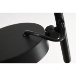 Czarna lampa wisząca LED Iseo 7W, z okrągłym, matowym sufitem, z metalowym mocowaniem i przewodem. Ujęcie z góry, ukazujące detal konstrukcji oraz punkt mocowania. Prosta, nowoczesna forma.